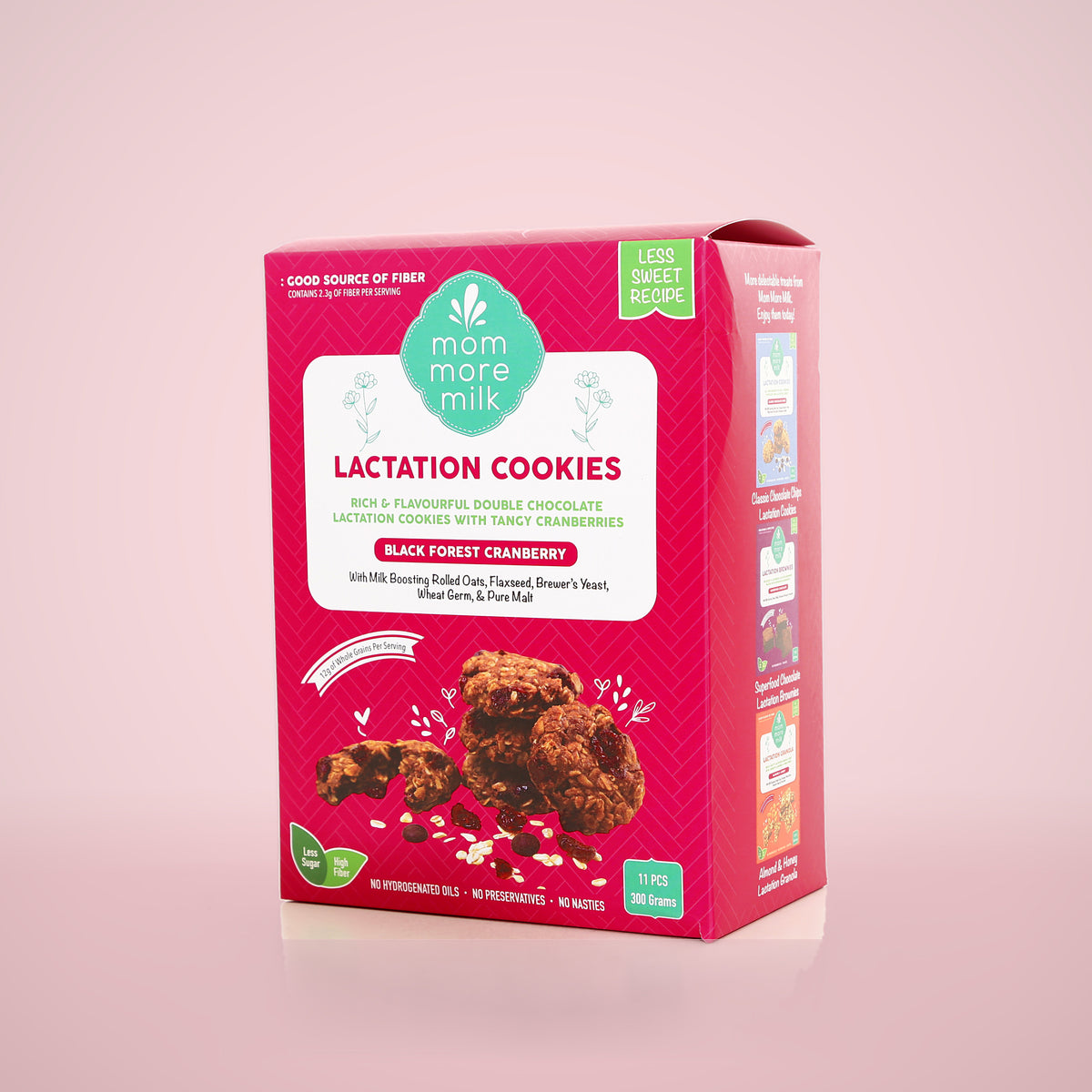 Black Forest Cranberry lactation cookies box on a pink backdrop